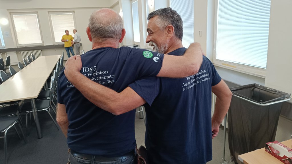 ©ICPDR image of two men giving their back to the camera in a large meeting room